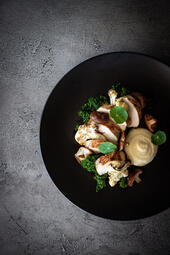 Roasted Chicken Breast. Roasted chicken breast with crispy skin, served with creamy parsnip puree, roasted cauliflower, shiitake mushrooms, and kale for a flavorful, balanced dish. (₩30,000)