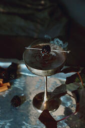 Smoke and Bramble.A bold cocktail with blackberry liqueur, dark rum, Mezcal, black tea, and spices, offering a smoky, fruity, and spiced flavor. (₩20,000)