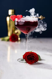 Love Potion Cocktail. A tasty, fresh and smooth triple berry martini cocktail with strawberry vodka, Chambord Black Raspberry liqueur and pomegranate juice.